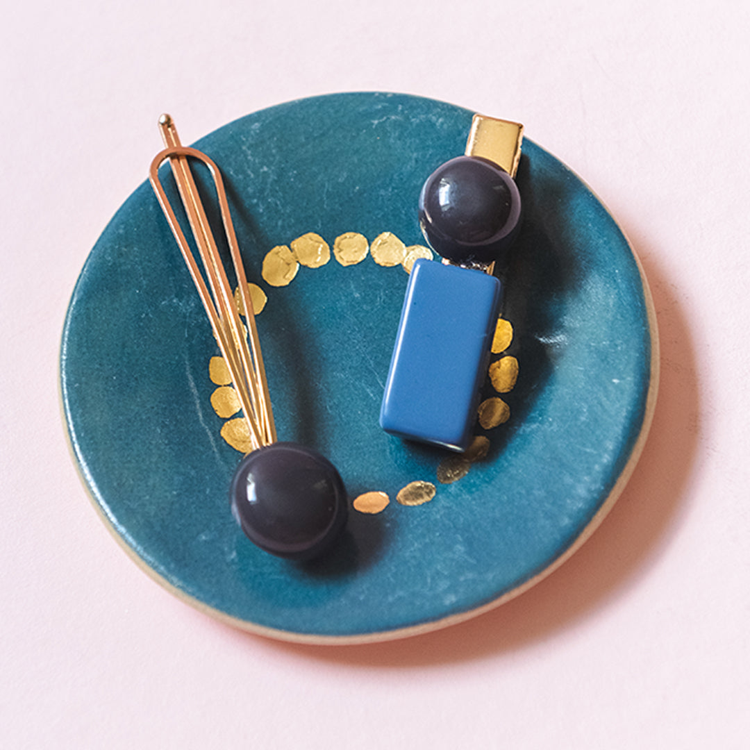 Blue & navy blue hair pin and clip with gold. Round bobble clip and pin that can be put in your hair to accessorize your outfit.