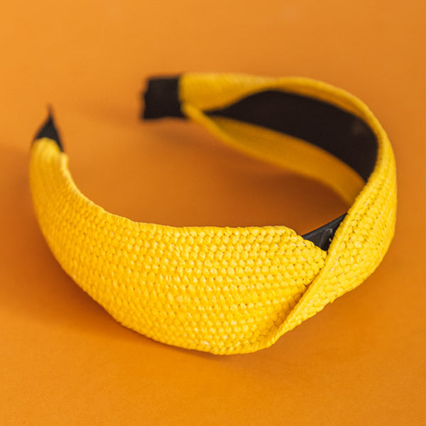 bright yellow woven raffia fabric twist top headband.