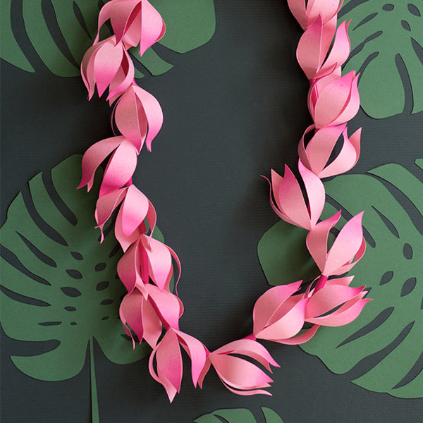pink paper lei cut with Cricut machine or by hand. Tropical setting.