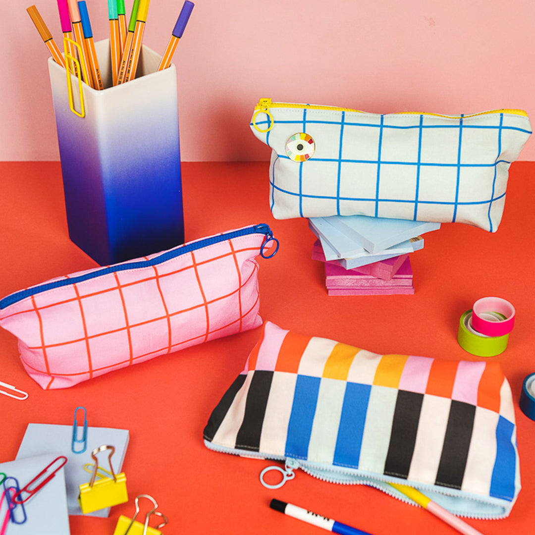 zipper pencil case with a grid design with multiple colors. What the pencil case pattern looks like