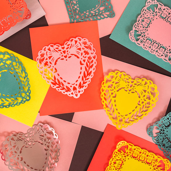 Doily valentines cut out from a craft cutting machine using cardstock paper. Bright colors. 3 different versions.